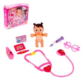 A doctors "Treating baby" with the doll, stethoscope, and accessories
