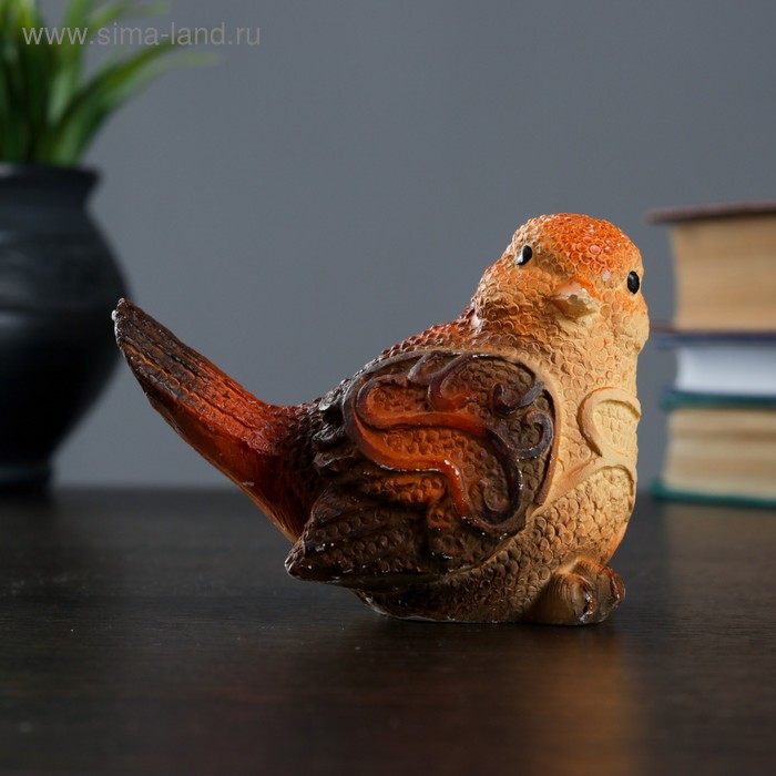 Asian man with birds figurines