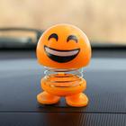The smile on the spring, on a panel in the car, laugh, yellow
