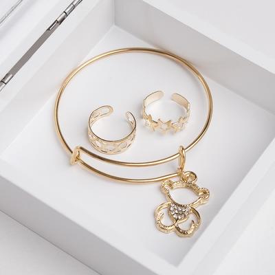 A set of children's "Vibracula" 3 PR: bracelet, 2 rings, bear, white gold