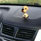 The dog on the dashboard of the car, shakes his head, SP12