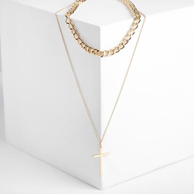 Pendant "Chain" is a cross with two strands of the color gold