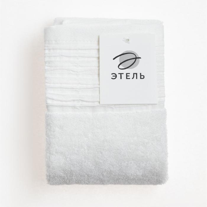 Полотенце маркет. Махровое полотенце нв Экстра м0812_02 s 35* 75 роз. Белое махровое полотенце сложено краем.